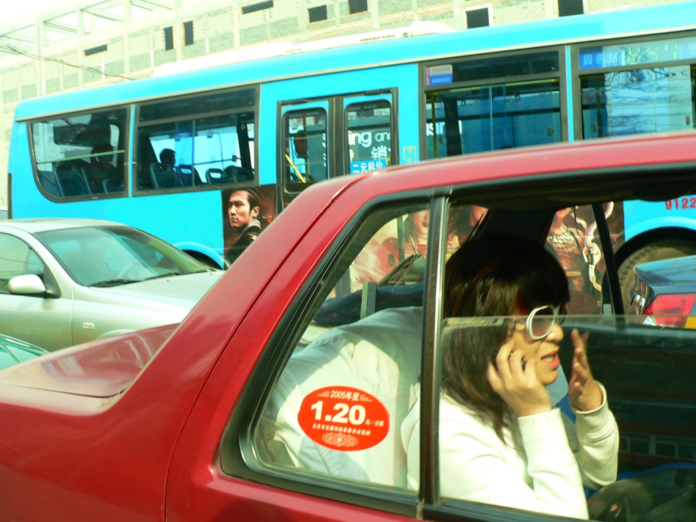 A red Xiali taxi in Beijing traffic, 2006